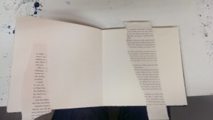 Step one:  glue down some torn book page for an under paint texture element.